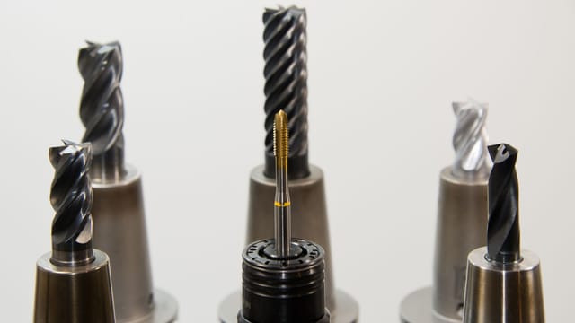 A detailed view of different drill bits used in industrial machining applications.