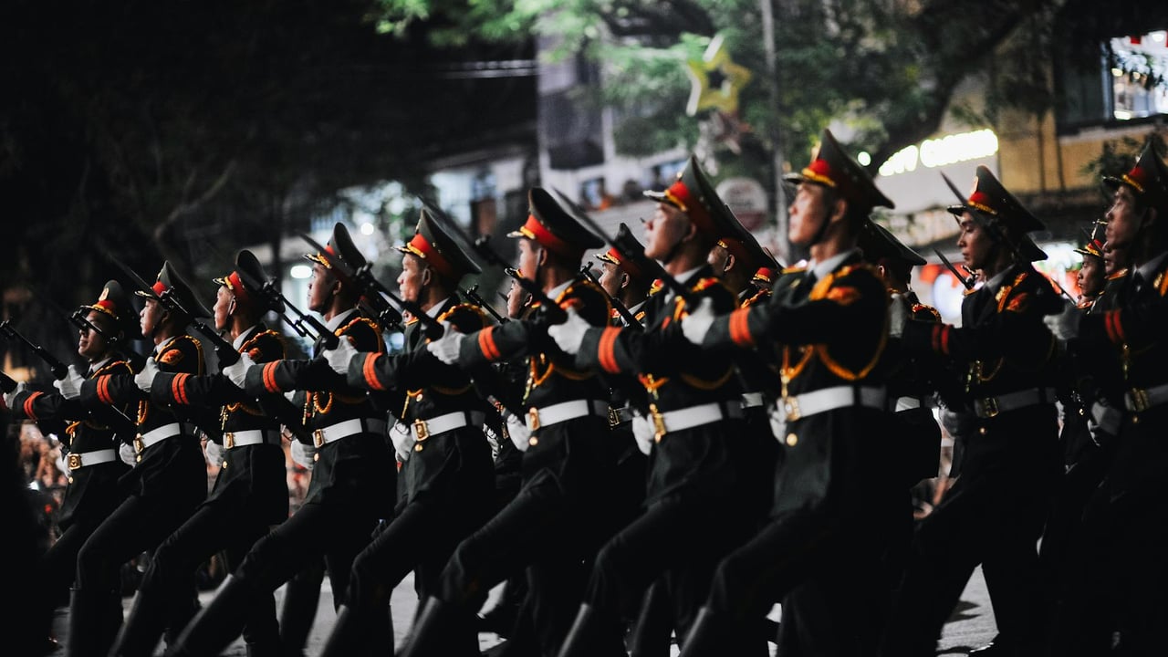 Nighttime military parade through the streets of Hanoi, Vietnam.