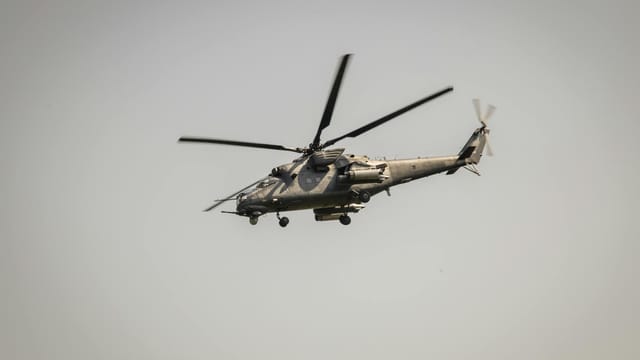 A military attack helicopter flying in the sky over Belgrade, Serbia.