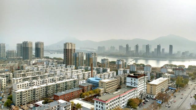 Aerial view showcasing modern urban skyline and architecture in China.