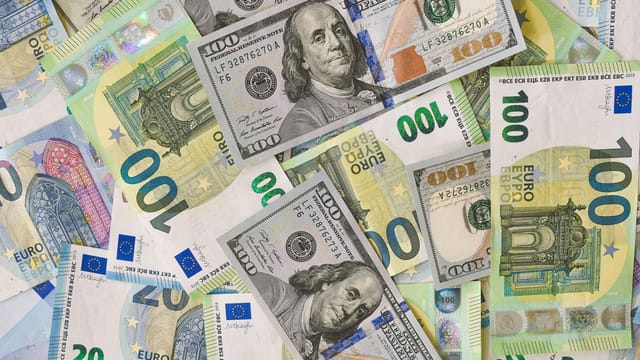 A detailed collage of Euro and Dollar banknotes showcasing international currency exchange.