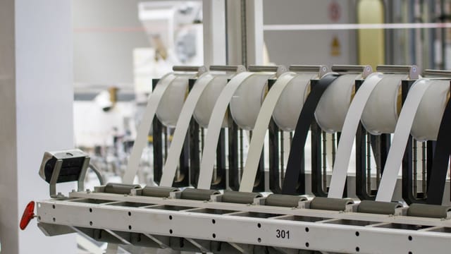 Illustrative image: Modern industrial machine in operation in a manufacturing facility showcasing advanced technology.