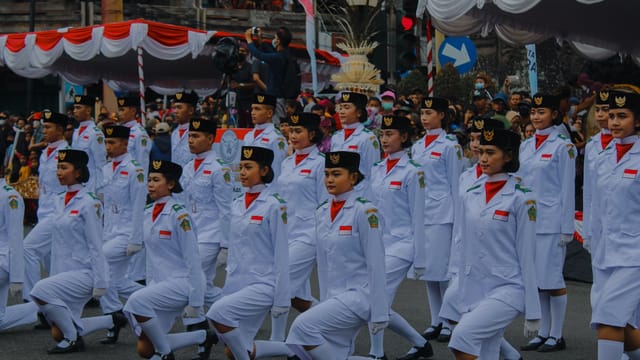 Indonesian youth in uniforms participate in a patriotic parade celebrating Independence Day in Jembrana, Bali.