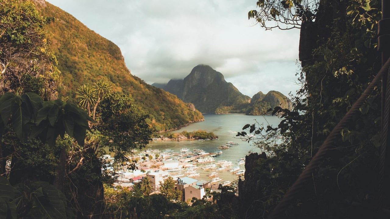 Breathtaking view of El Nido's lush mountains and serene waters in the Philippines.