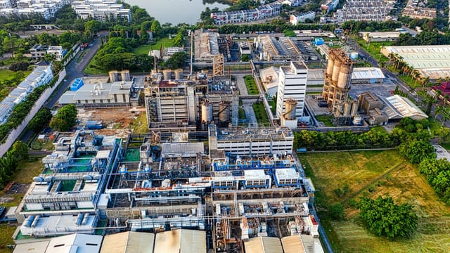 Aerial view of a sprawling industrial complex and surrounding residential area in Banten, Indonesia.