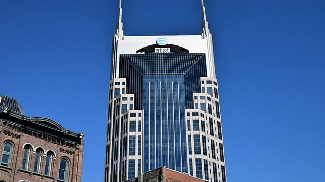 View of the AT&T building in Nashville, showcasing modern architecture under a clear blue sky.