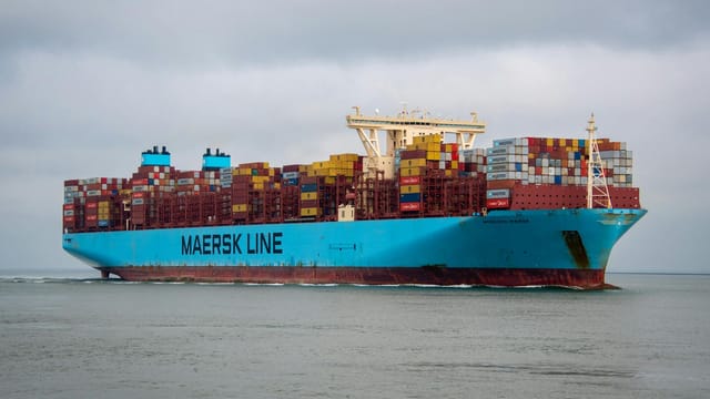 A Maersk Line container ship majestically sails on the sea near Terneuzen, Holland.