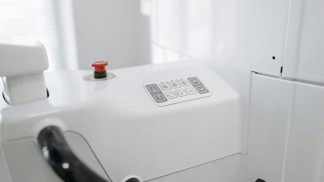 Close-up of advanced dental machine in a bright, modern clinic.