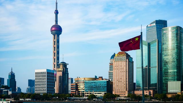 Stunning view of Shanghai's skyline featuring the iconic Oriental Pearl Tower and modern skyscrapers.