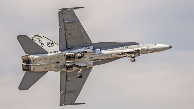 Dynamic view of an F/A-18 Hornet jet showcasing military aviation excellence over Florida.