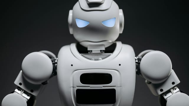 Detailed studio shot of a modern robotic toy with a dark background, showcasing technological design.