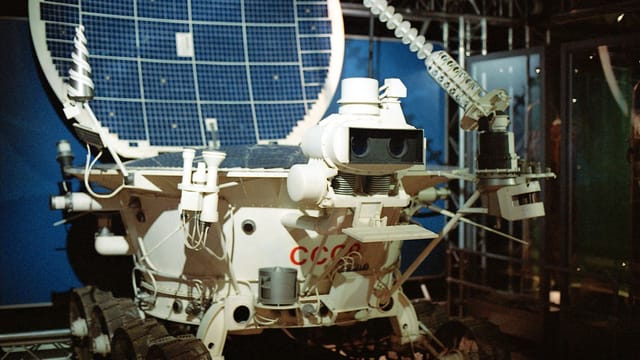 A Soviet Lunokhod lunar rover displayed in a museum, showcasing space exploration history.