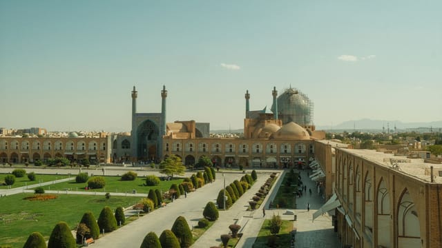 Arial view of Naqsh-e Jahan Square in Isfahan, showcasing stunning Persian architecture.
