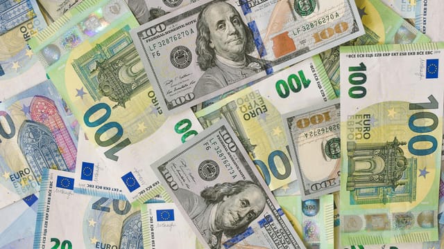 A detailed collage of Euro and Dollar banknotes showcasing international currency exchange.