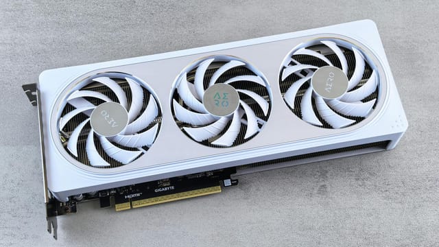 Stylish white graphics card with three cooling fans on a neutral background, ideal for tech enthusiasts.