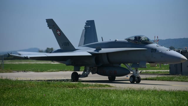 Swiss Air Force F/A-18 Hornet jet parked on the airfield at Payerne, Switzerland.