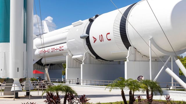 Outdoor display of a NASA rocket at Kennedy Space Center showcasing aerospace technology.