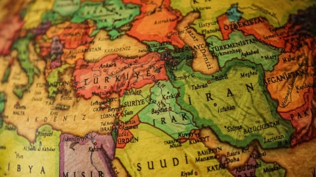 Close-up of a colorful map depicting countries of the Middle East.