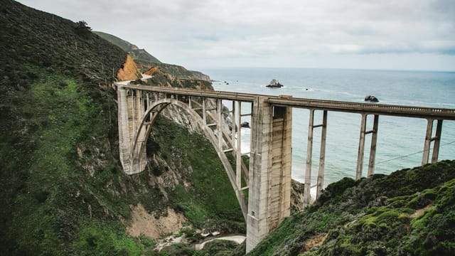Bixby Creek Bridge spans majestic cliffs along California's scenic coastal highway.