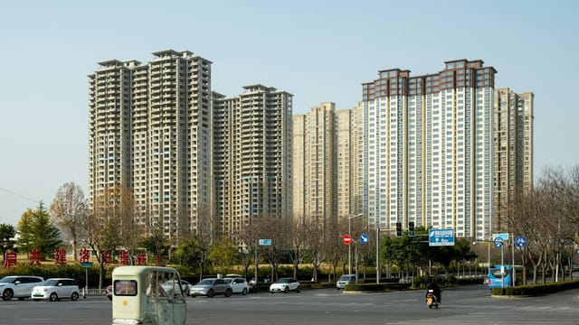 High-rise buildings and traffic at a busy intersection in Luoyang, China.