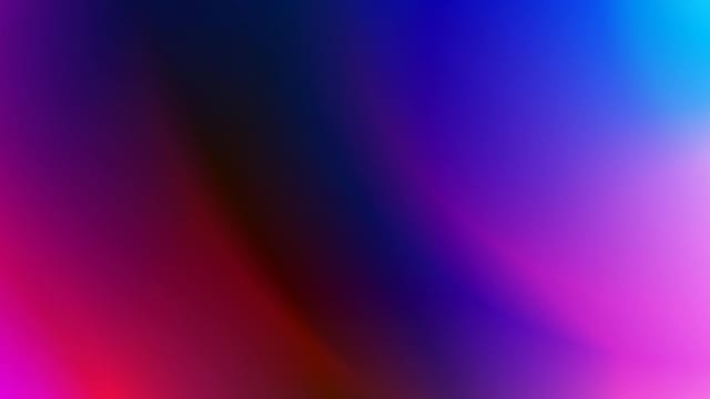 A vivid abstract gradient featuring bold pink, purple, and blue hues.