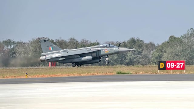 Tejas fighter jet taxiing on runway at Yelahanka Air Force Station, Bengaluru, India.