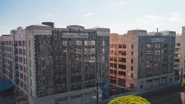 Art Deco building of the Southern Pacific complex in Los Angeles under sunny skies showcasing urban architecture.