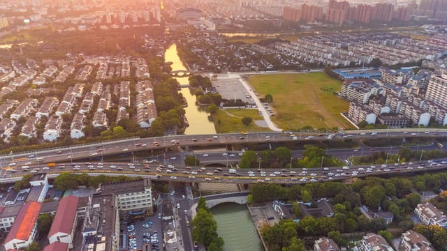 A breathtaking aerial view of Suzhou, China capturing the city's landscape at sunset.