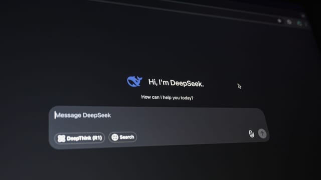 Close-up of a digital assistant interface on a dark screen, showcasing AI technology communication.