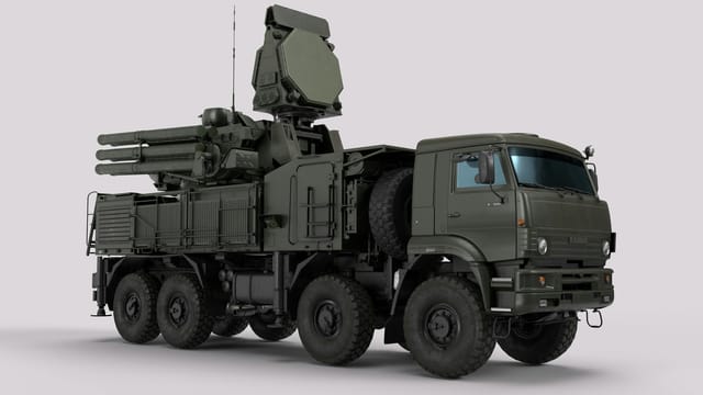 Detailed image of a military vehicle equipped with advanced radar and weaponry systems.
