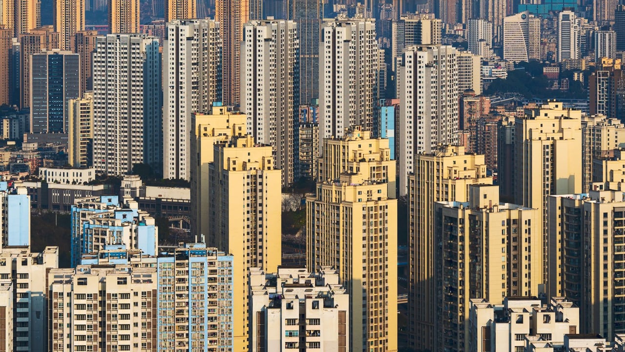 Aerial view of densely packed high-rise buildings in a vibrant urban skyline.