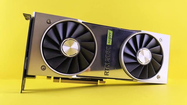 Close-up of a RTX 2080 Super graphics card against a bright yellow backdrop, showcasing high-tech design.
