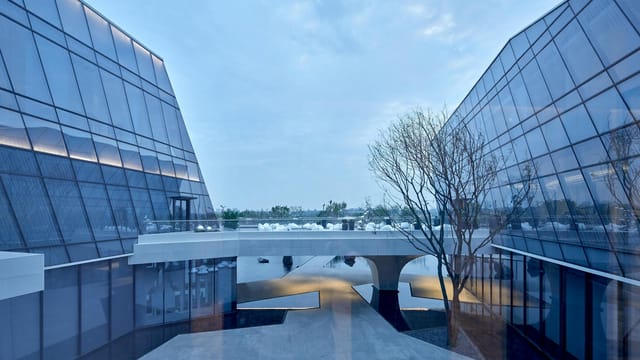 Captivating view of modern glass buildings and bridge structure in China.