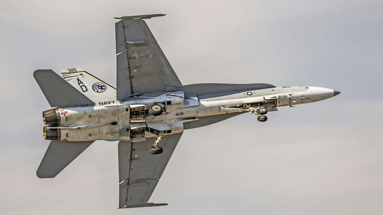 Dynamic view of an F/A-18 Hornet jet showcasing military aviation excellence over Florida.