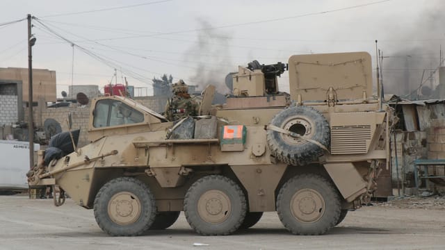A military vehicle in an urban conflict environment in Al Hasakah, Syria.