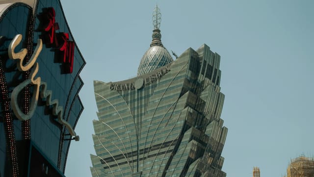 A striking view of the iconic Grand Lisboa Casino in Macau, showcasing its unique architecture.