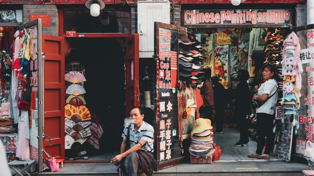 Authentic street view of a shop in Beijing selling traditional Chinese goods and crafts.