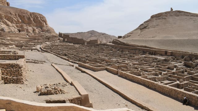 Explore the historic ruins of Deir el-Medina, an ancient village in Egypt's desert landscape.