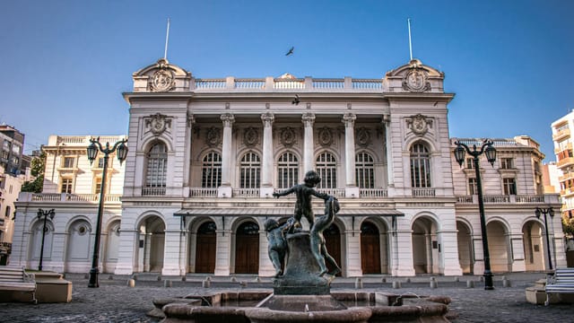 Elegant view of the historic Municipal Theatre in Santiago, Chile with a central fountain.