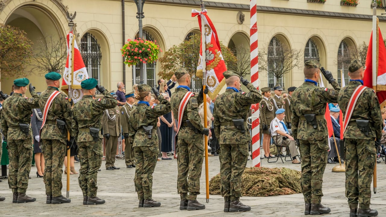 Polish soldiers in military uniforms at a formal parade in Wrocław, showcasing national pride and ceremonial display.