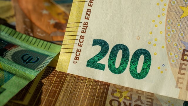 Detailed close-up of a 200 Euro banknote highlighting currency design and details.
