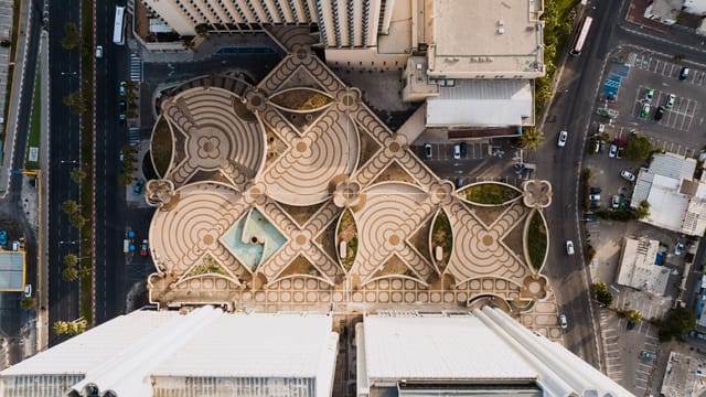 Drone shot capturing unique geometric rooftop patterns in Tel Aviv, Israel.