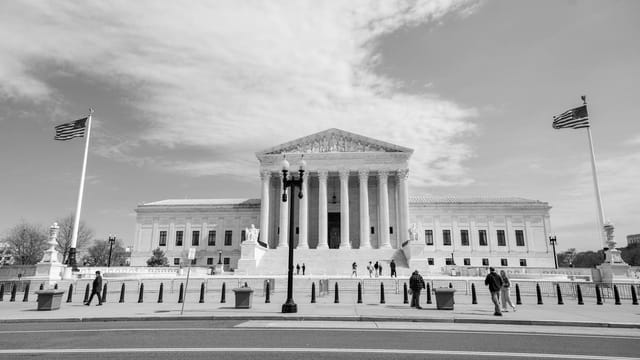 Classic view of the US Supreme Court building in Washington, D.C., highlighting neoclassical architecture.