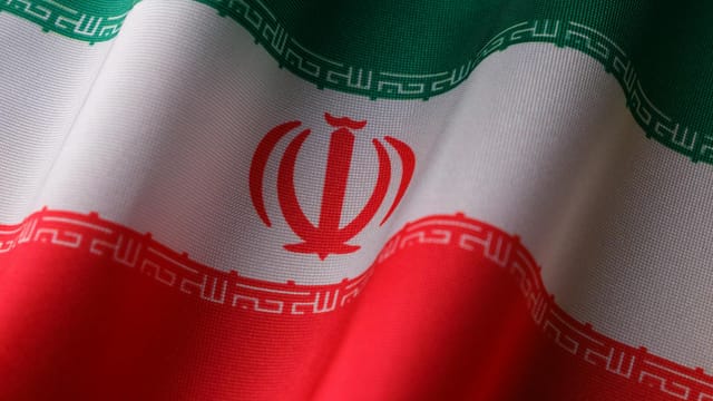 High-quality image of the Iranian national flag waving to symbolize patriotism and national pride.