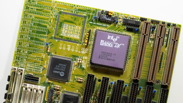 Close-up view of a vintage Intel i486 DX motherboard, highlighting retro technology.