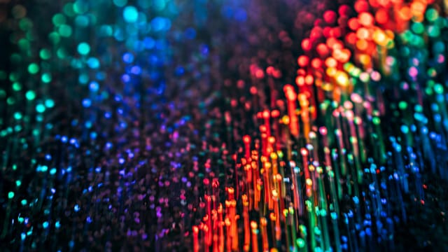 Abstract image showcasing vibrant and colorful light patterns, creating a magical and futuristic atmosphere.