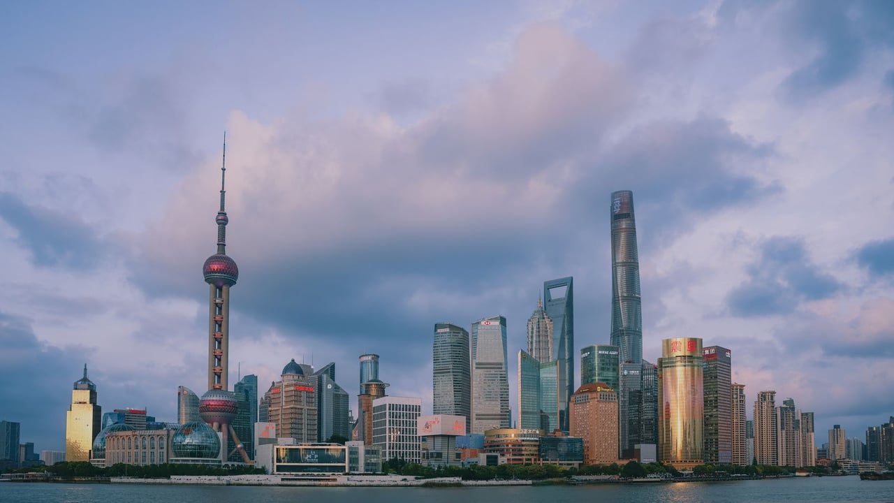Beautiful skyline of Shanghai with iconic skyscrapers and vibrant cityscape at dusk.