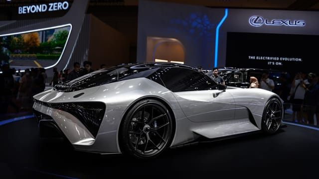 Modern electric sports car displayed at international auto show. Sleek design and futuristic features.