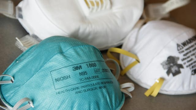 Detailed close-up of various N95 masks for healthcare and protection, highlighting design and material.