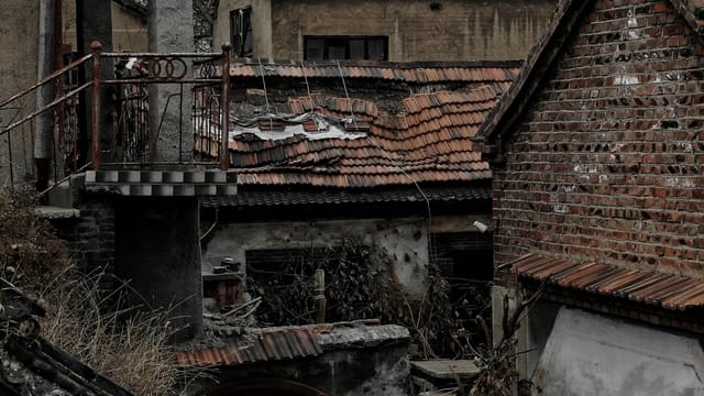 Weathered brick houses in an abandoned area of Zibo, Shandong Province, exuding a rustic charm.